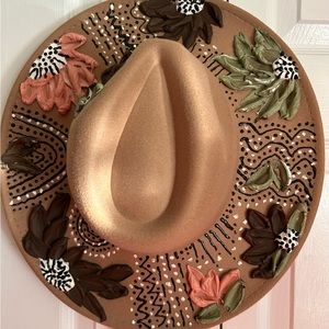 Large brim fadora hat hand painted with texture paint. Does not peal off.